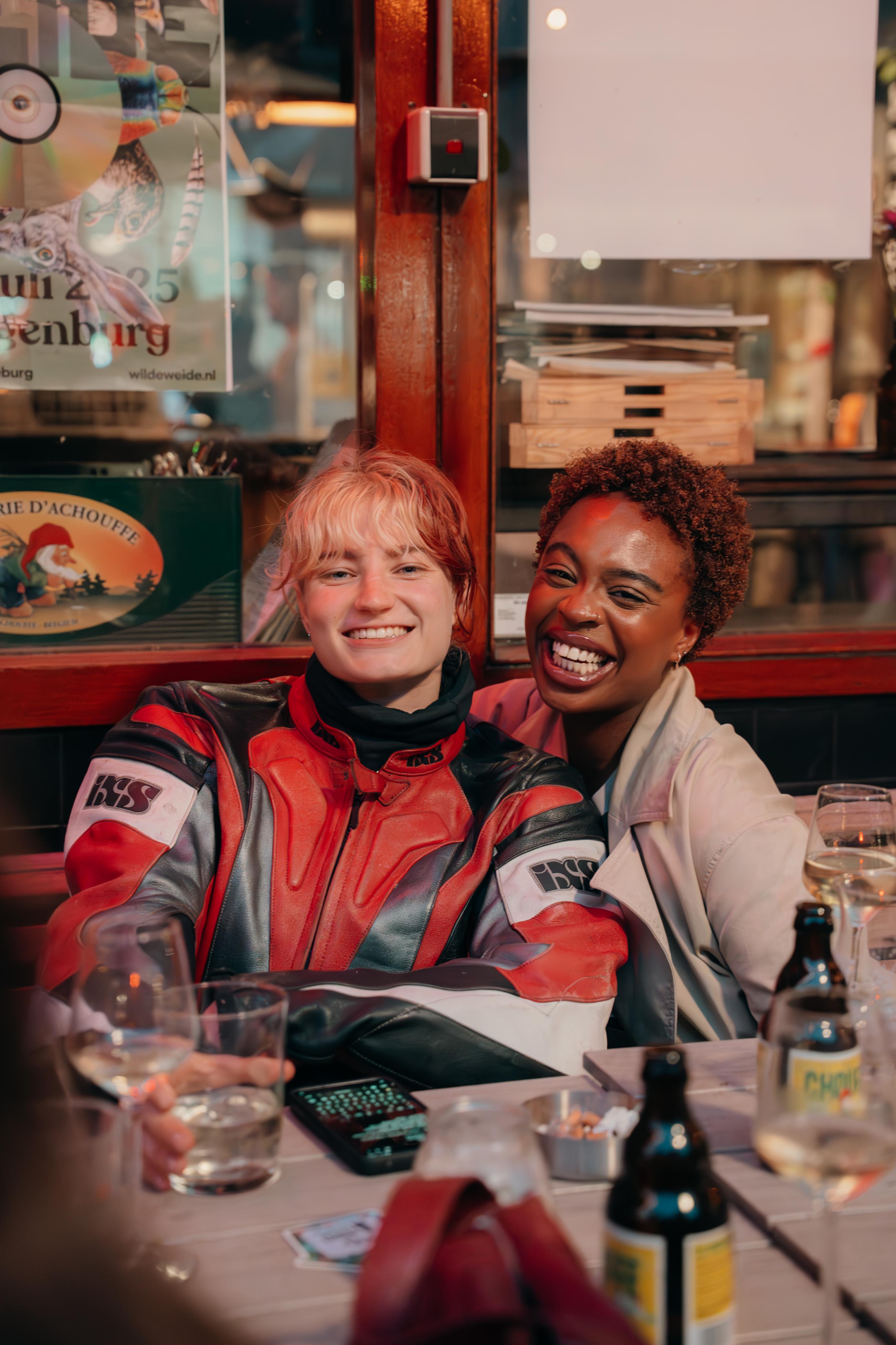 Two Skanna team members enjoying a social moment together at a cozy venue